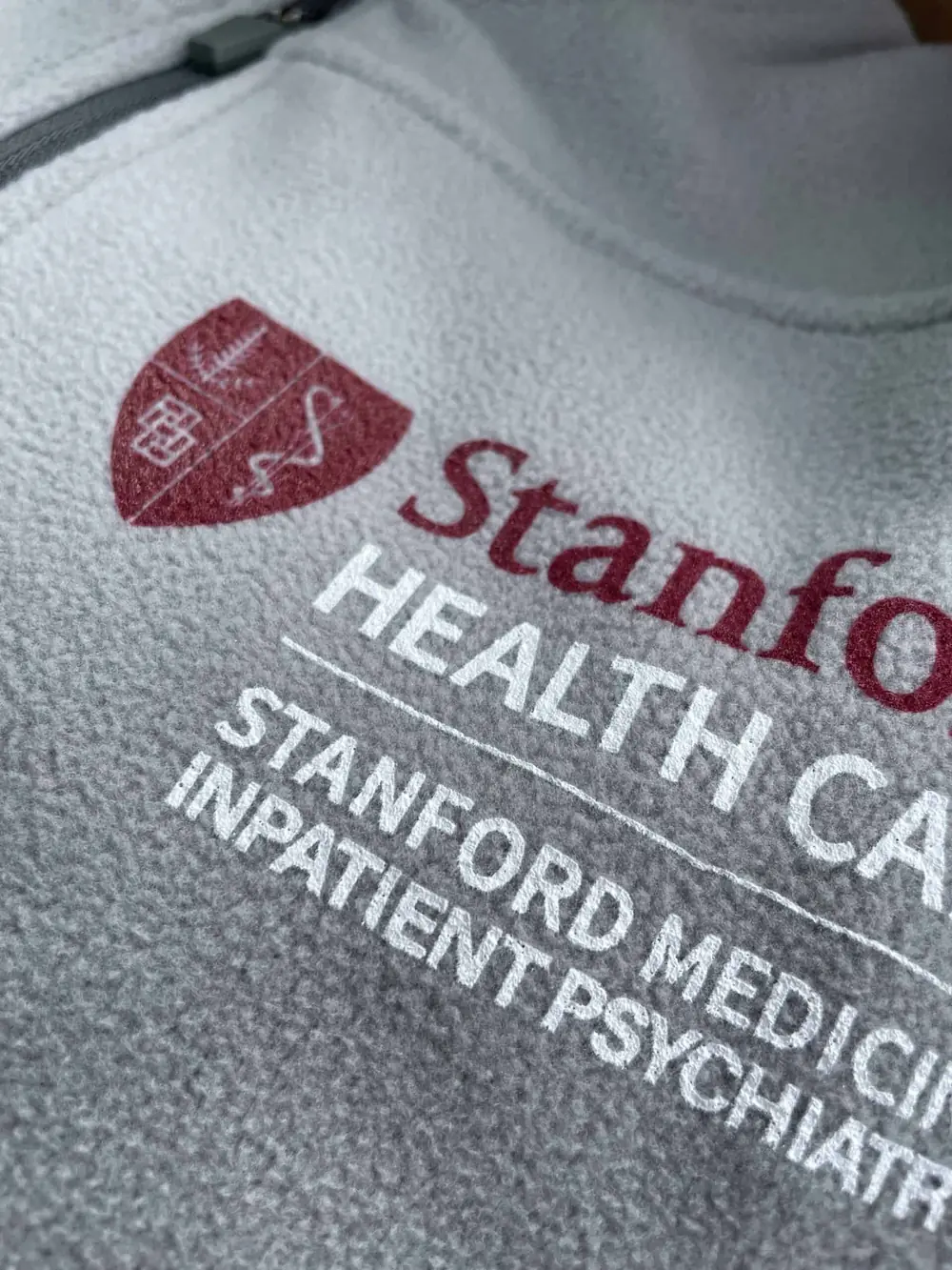 Grey jacket printed with the Stanford Health Care logo